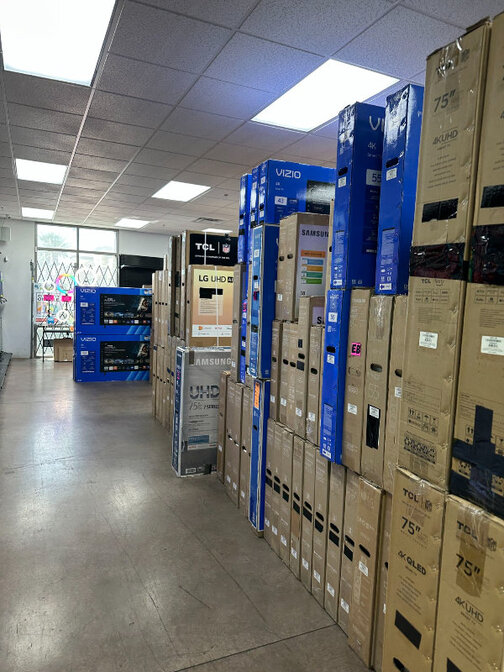 Aisles of boxed TVs in stock at Best Deal Vegas